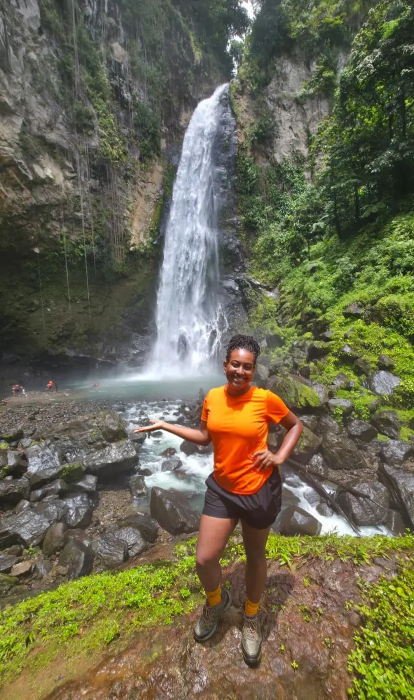 Channon Christian, owner and guide of Chasing Adventure Tours, at a Dominica waterfall