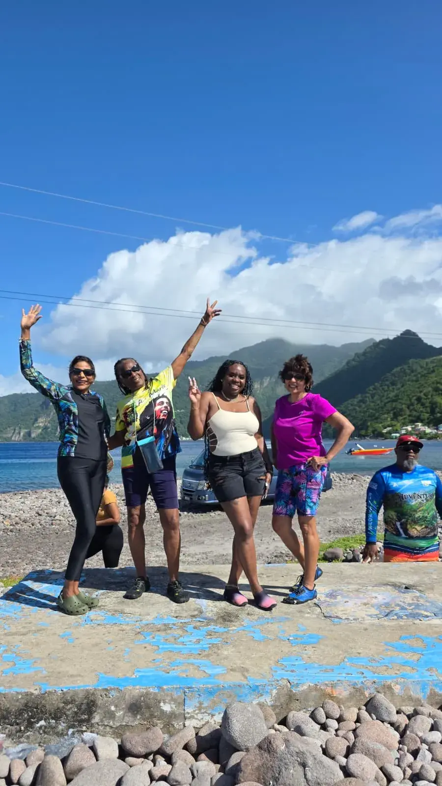 Chasing Adventure Tours guests with snorkel gear on the Dominica coast