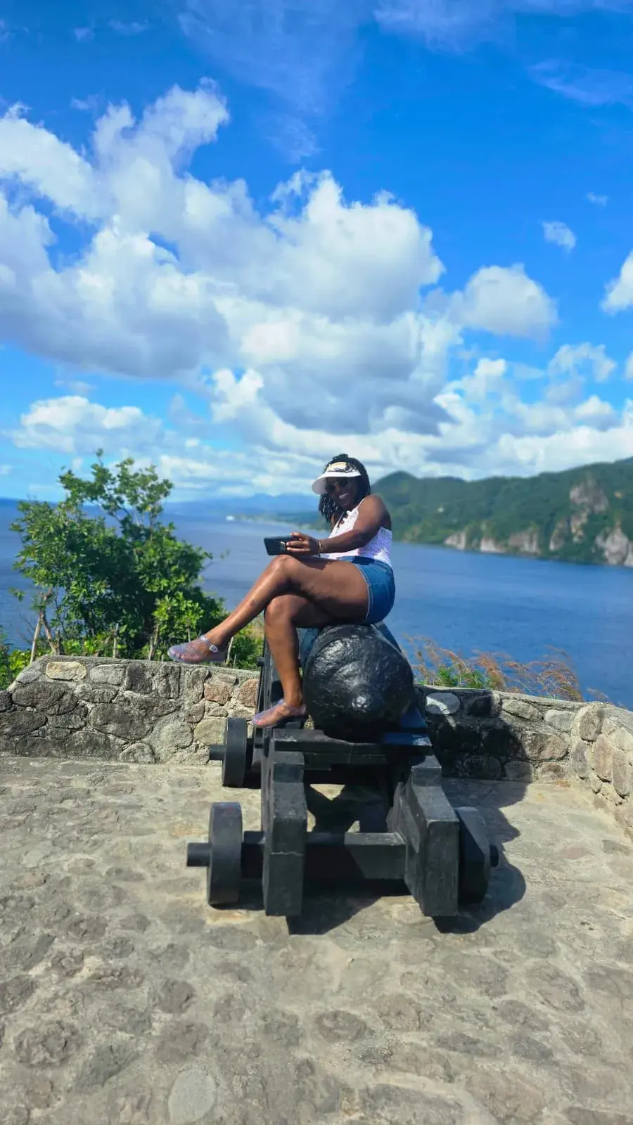 Guest at a historic coastal cannon viewpoint