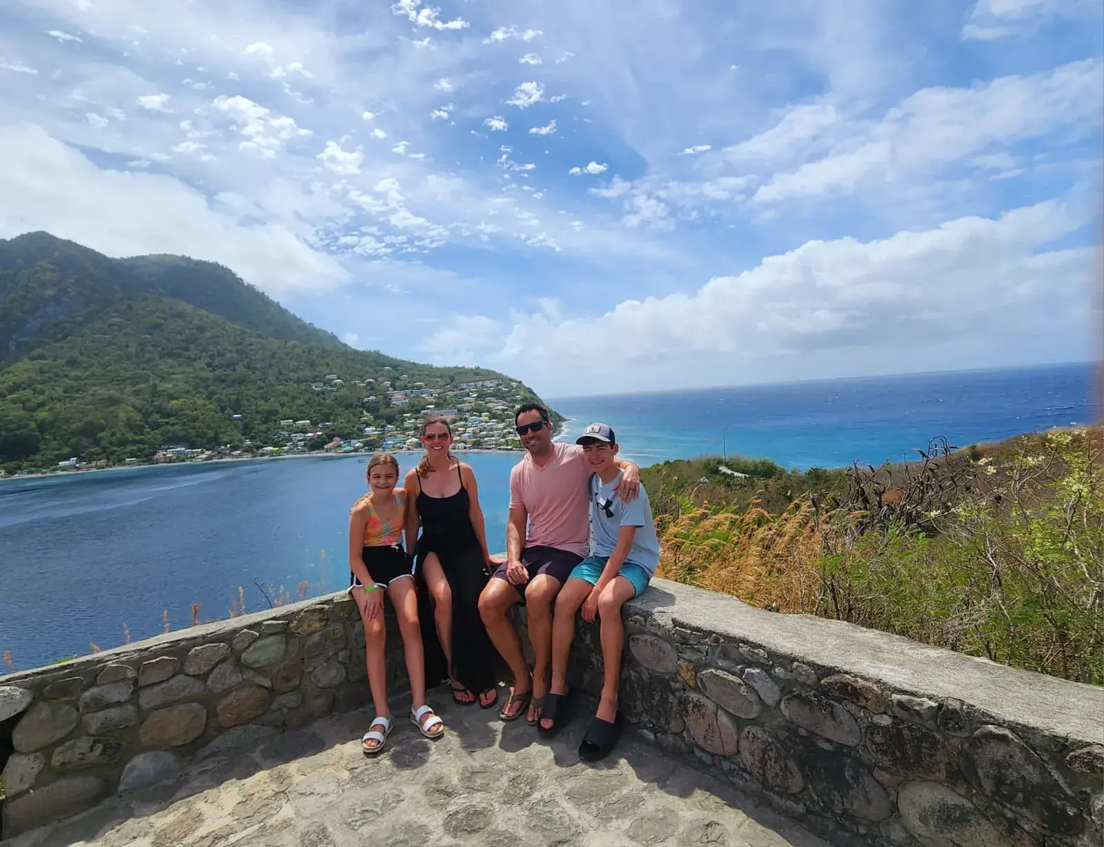 Guests enjoying a coastal viewpoint in Dominica