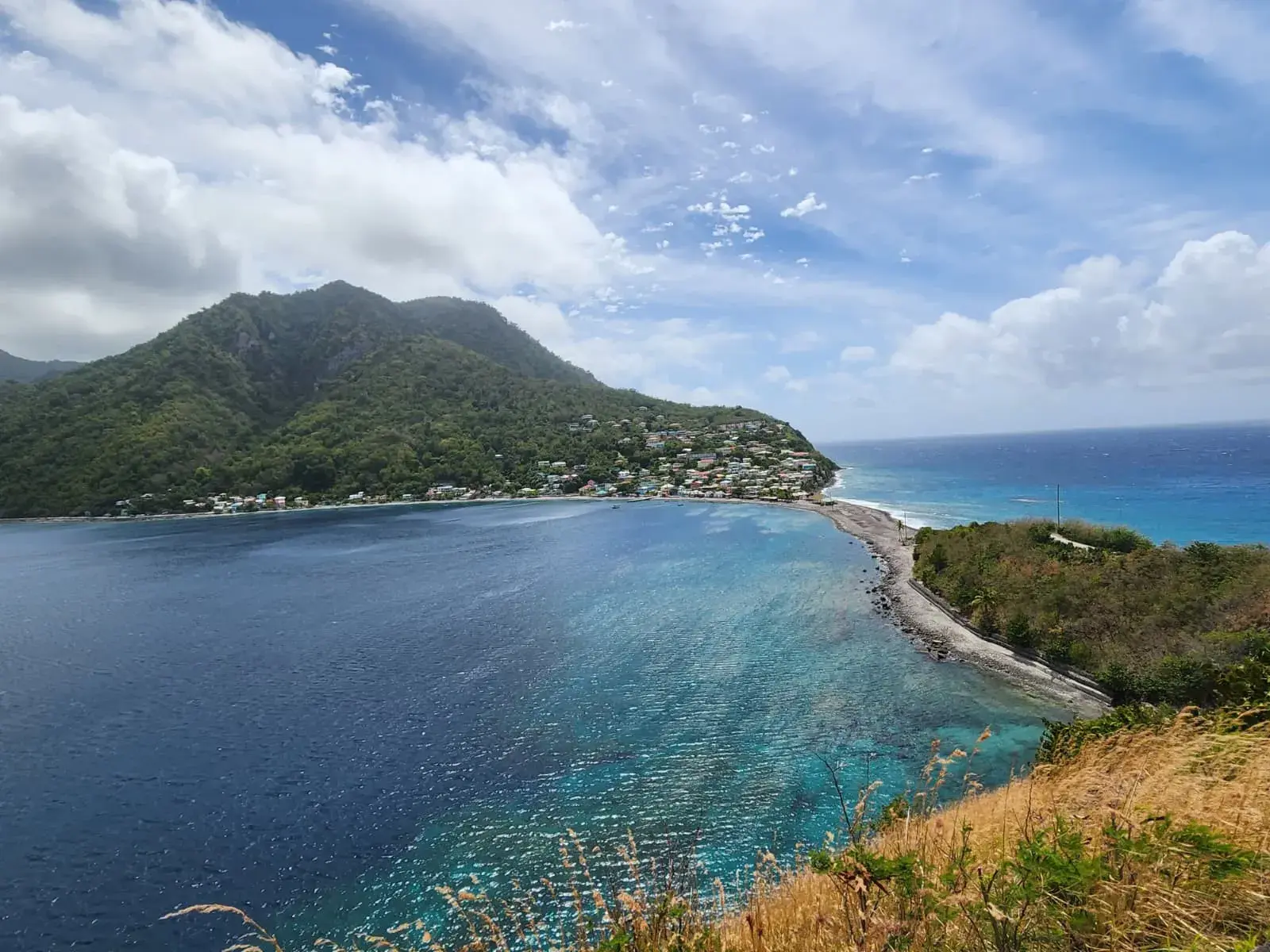 Turquoise bay and village on Dominica’s south coast