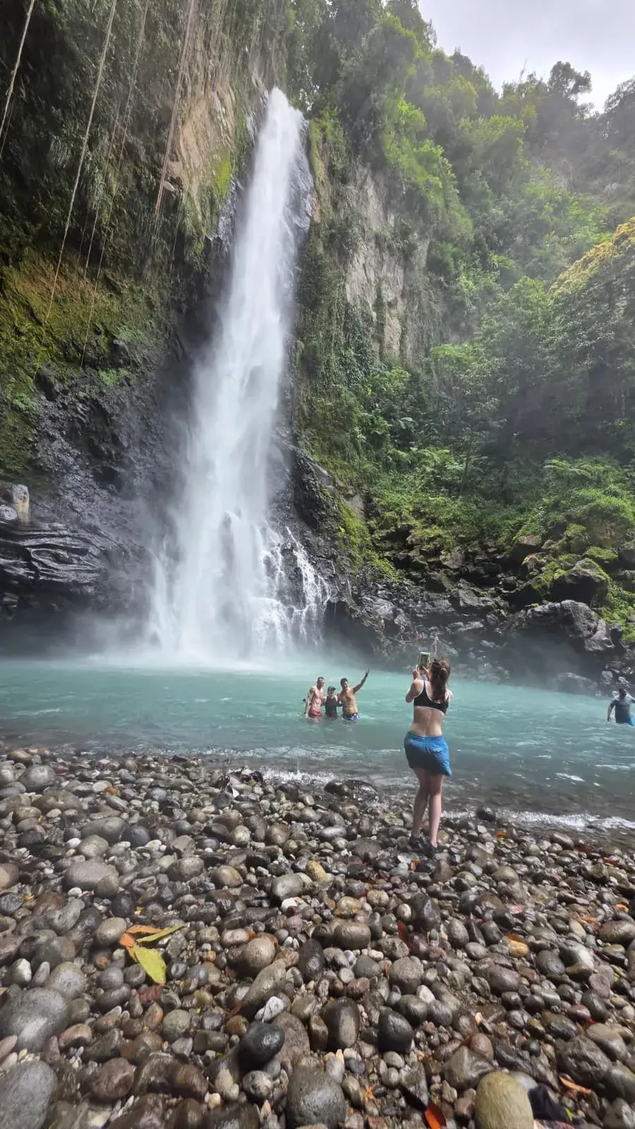 Victoria Falls tumbling into a turquoise plunge pool in Dominica