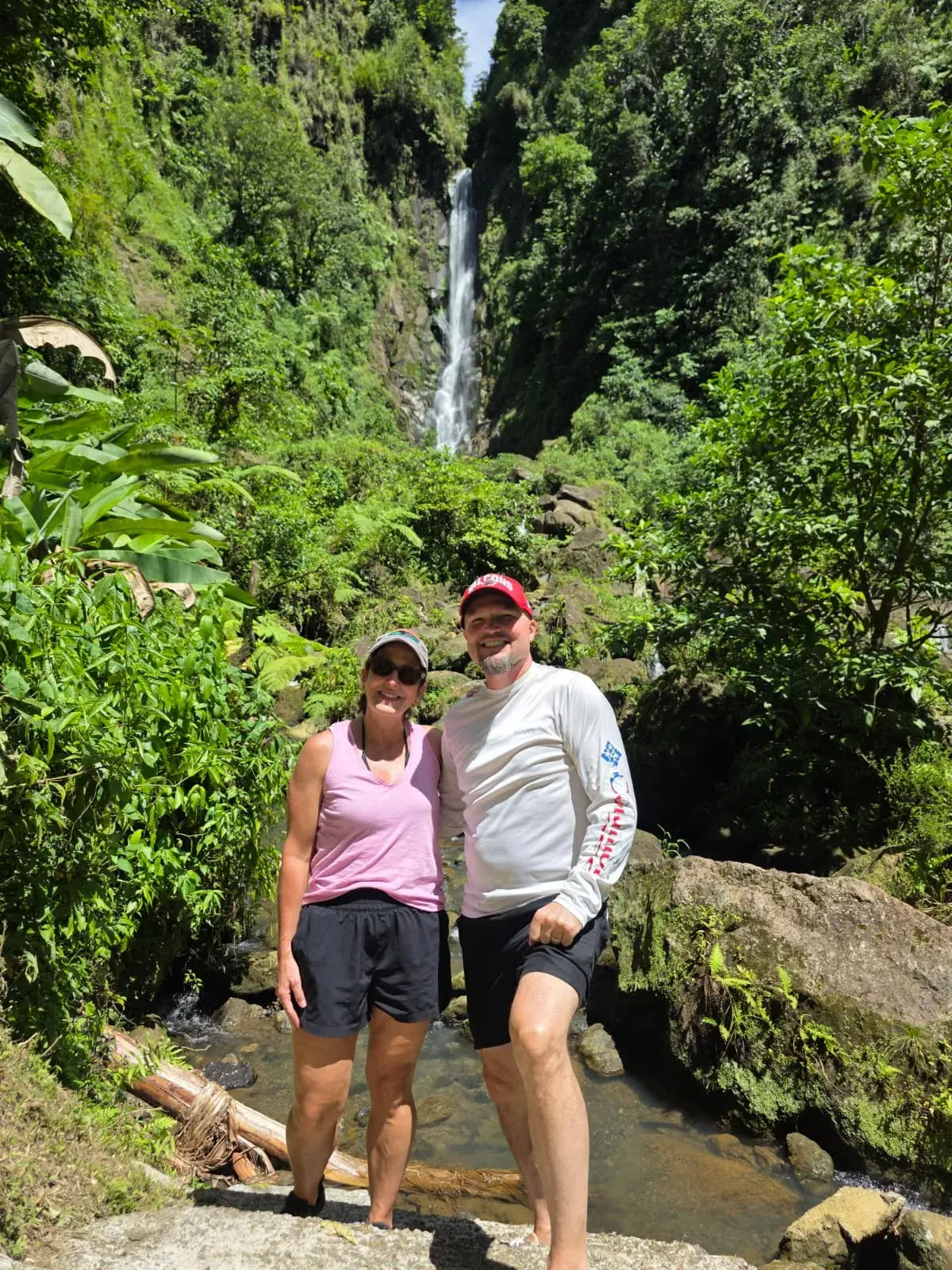 Couple on a rainforest trail in Dominica